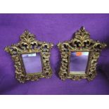 A pair of modern gilt plaster hall mirrors