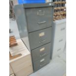 A vintage metal 4 drawer filing cabinet