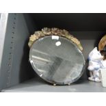 A dressing table mirror with plaster surround