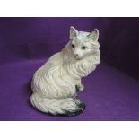 An early 20th century cat figurine