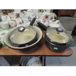 Three cooking pots by AGA and a cream or butter bowl