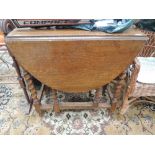 An early to mid 20th Century oak twist gate leg table