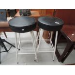 A pair of vintage metal frame bar stools