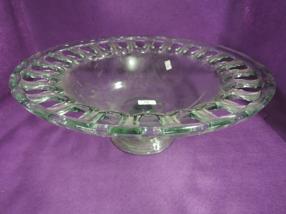 A large aqua glass fruit bowl