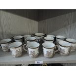 A selection of coffee cups with plated handles by Marco