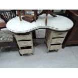 A traditional ply kidney shaped dressing table