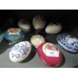 A selection of ceramic decorative eggs including Wade
