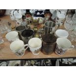 A selection of cups including copper and brass Mexican Inca design tankard