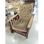 A traditional oak lounger chair