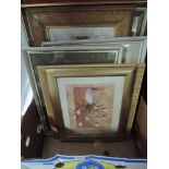 A selection of floral prints and picture frames