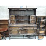 An early 20th Century oak panelled dresser