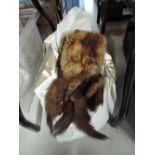 Two vintage fur stoles,one fox with feet and head, good condition, pelts are soft and supple.