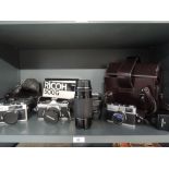 Three 35mm cameras, an Olympus 35RC, an Olympus Om2n and a Ricoh 500G and Sigma High speed zoom 80-