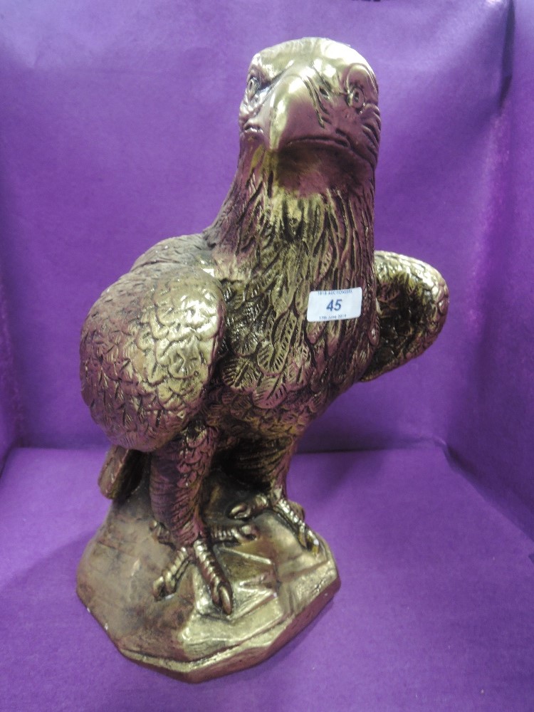 A life size gilt and plaster cast figure of and eagle or similar bird of pray