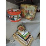 A selection of advertising tins and ephemera