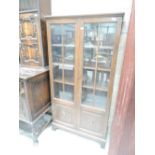 An early to mid 20th Century oak bookcase