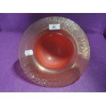 An orange and amber art glass bowl by Adrian Sankey