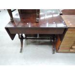 A reproduction mahogany sofa style side table