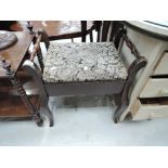 An early 20th Century mahogany piano stool