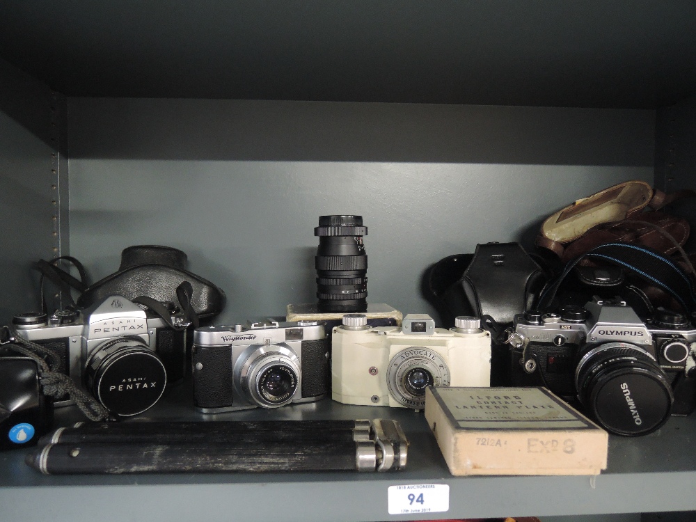 A selection of cameras including a Pentax, a Voigtlander Vito B, an Ilford Advocate an Olympus