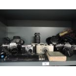 A selection of cameras including a Pentax, a Voigtlander Vito B, an Ilford Advocate an Olympus