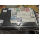 An album of First Day covers, presentation packs and postcards