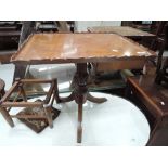 A reproduction occasional/low wine table