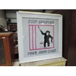 A Banksy style graffiti framed print, with frame exterior decoration
