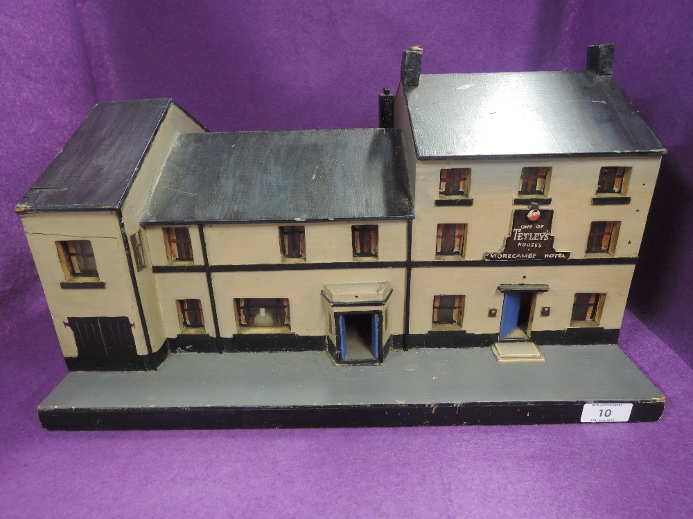 A replica model of local tavern The Morecambe Hotel with Tetleys advertisment integrated