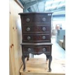 A reproduction Regency serpentine front bedside chest