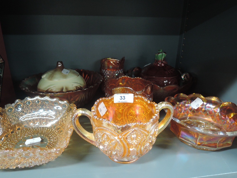 A selection of orange lustre carnival glass wares