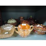 A selection of orange lustre carnival glass wares