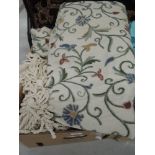 A pair of good quality cream curtains having wool embroidered detailing.