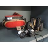 Two pairs of Binoculars, a Rainbow 7x25 extra wide angle and russian 8x30 pair