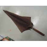 A carriage parasol umbrella