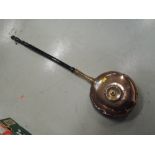 A copper bodied bed warming pan