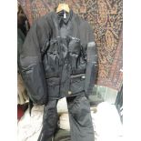 An Aqua motor cycle trouser and jacket set