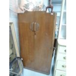 A mid 20th Century golden oak wardrobe