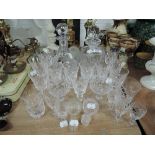 A selection of clear cut crystal glass wares including decanters