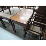 A 19th century mahogany drop leaf dining table having end drawer and turned legs