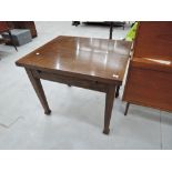 An early to mid 20th Century oak drawer leaf dining table