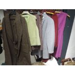 Mixed lot of ladies wool and wool based dresses, skirts,capes and similar. Mixed styles and sizes,