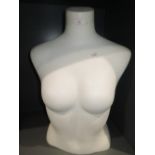 A shop display manikin torso