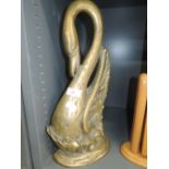 A brass cast and weighted door stop in Swan or similar bird design