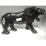 A treen figure modelled as Lignum Vitae style lion