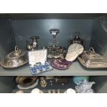 A selection of silver plate including lidded tureens, silver condiment bottle stand (no bottles),