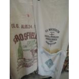 A selection of advertising sacks including Ulverston