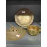 A selection of brass ware including Scottish quiche and sun dial