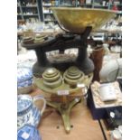 A selection of kitchen wares including brass trivet