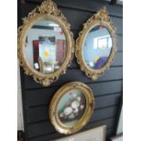 A pair of gilt and plaster style framed mirrors and similar oil on canvas